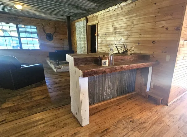 a stove top oven sitting inside of a kitchen