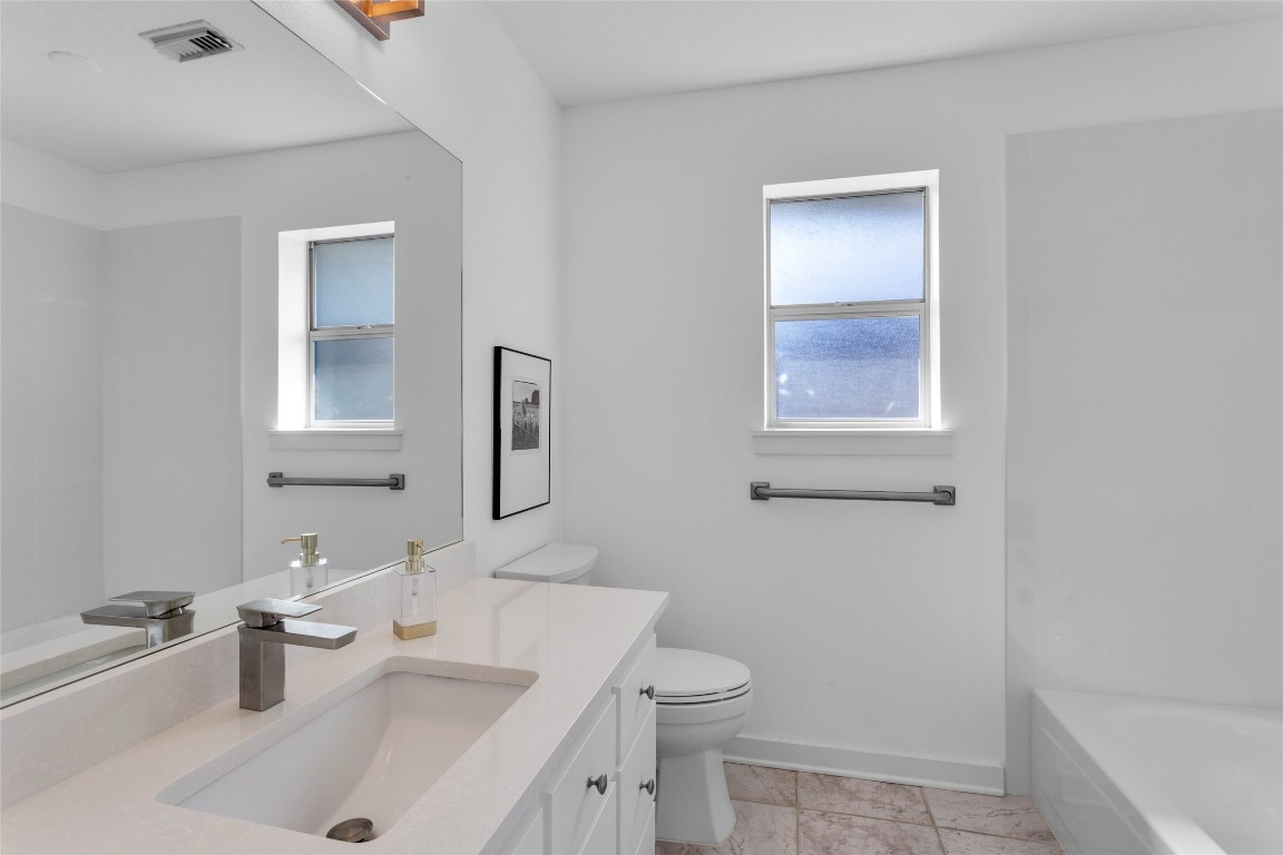 67 Harbor Lane Kemah, TX 77565 - Photo 22 of 47 a bathroom with a sink toilet and shower