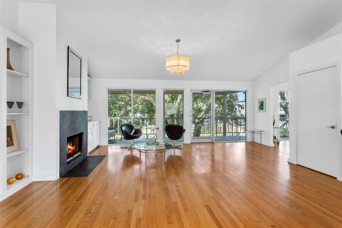 67 Harbor Lane Kemah, TX 77565 - Photo 6 of 47 a view of a livingroom with furniture a fireplace and wooden floor