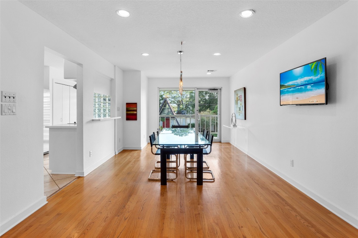 67 Harbor Lane Kemah, TX 77565 - Photo 7 of 47 a dining room with furniture and wooden floor