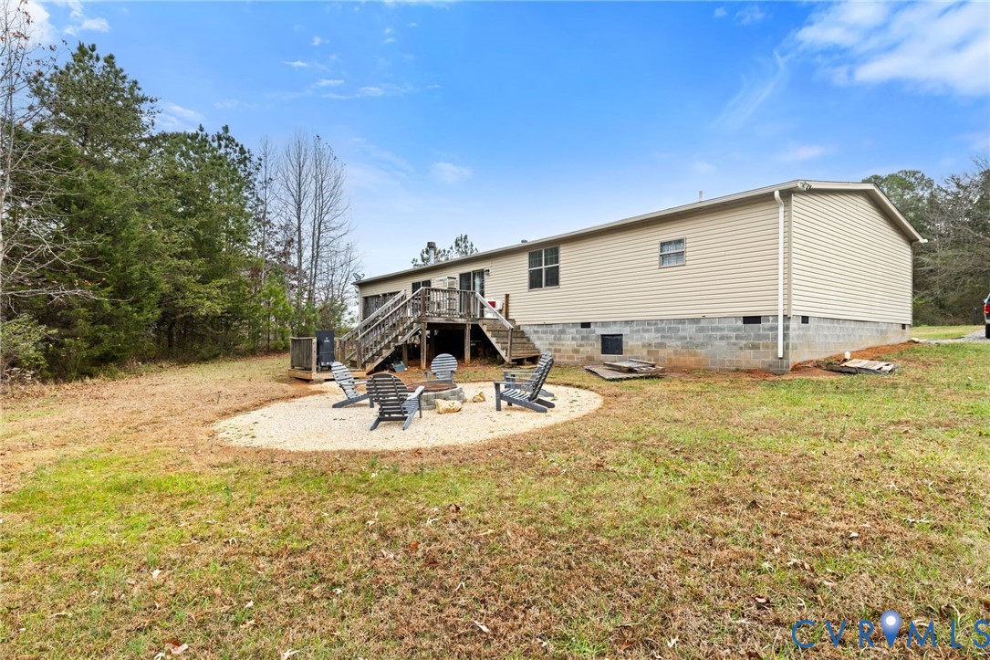 11391 Watkins Road Rockville, VA 23146 - Photo 27 of 28 a view of a swimming pool with an outdoor space and seating area