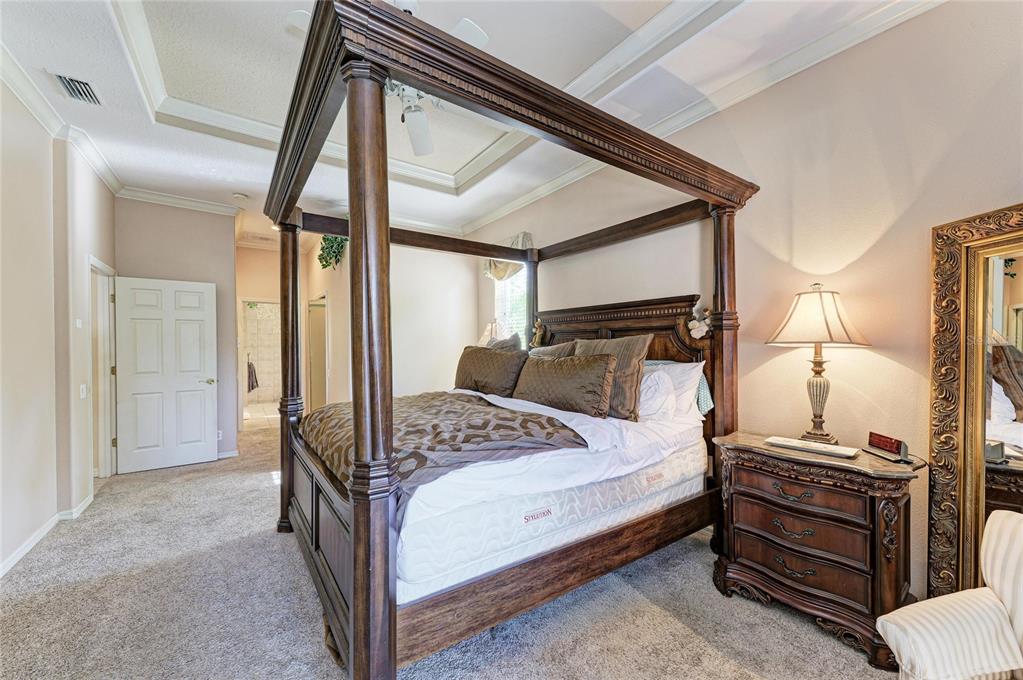 5060 Robinsong Road Sarasota, FL 34233 - Photo 27 of 42 a bedroom with a bed and a dresser