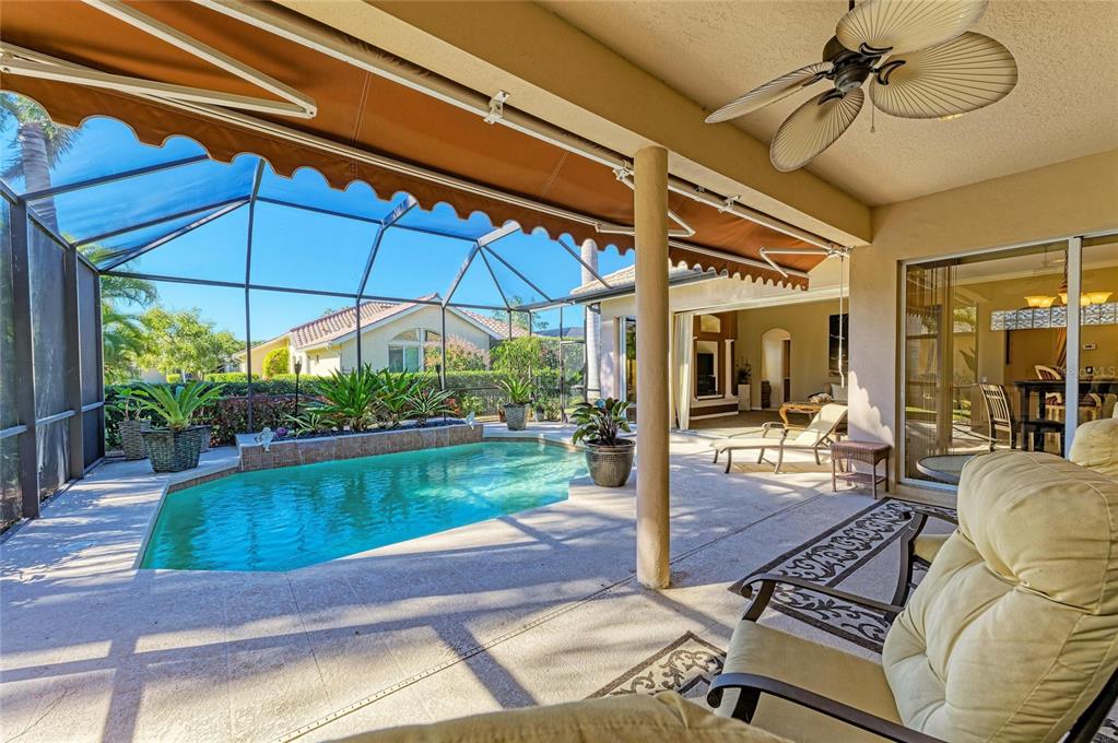 5060 Robinsong Road Sarasota, FL 34233 - Photo 38 of 42 a view of a backyard with a patio and fire pit