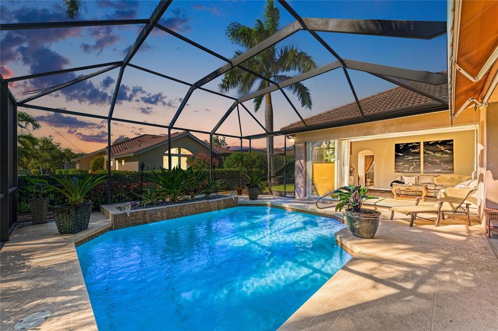 5060 Robinsong Road Sarasota, FL 34233 - Photo 40 of 42 a view of a swimming pool with a patio