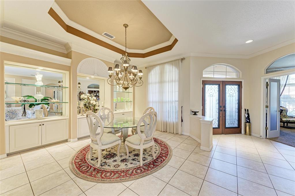 5060 Robinsong Road Sarasota, FL 34233 - Photo 9 of 42 a view of a livingroom with furniture and a chandelier