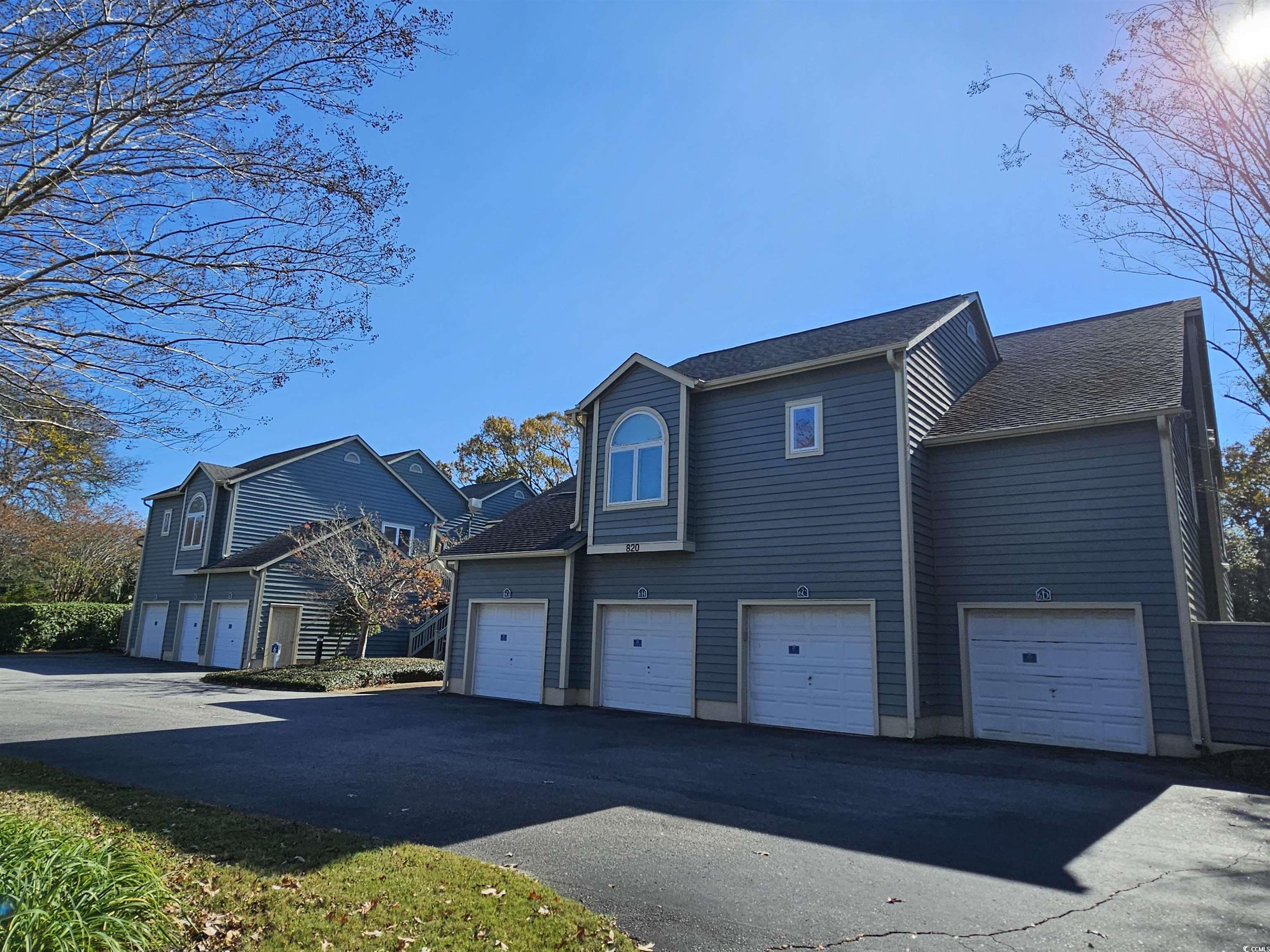820 Castleford Circle, Unit 6D Myrtle Beach, SC 29572 - Photo 1 of 40 View of front facade featuring a shingled roof