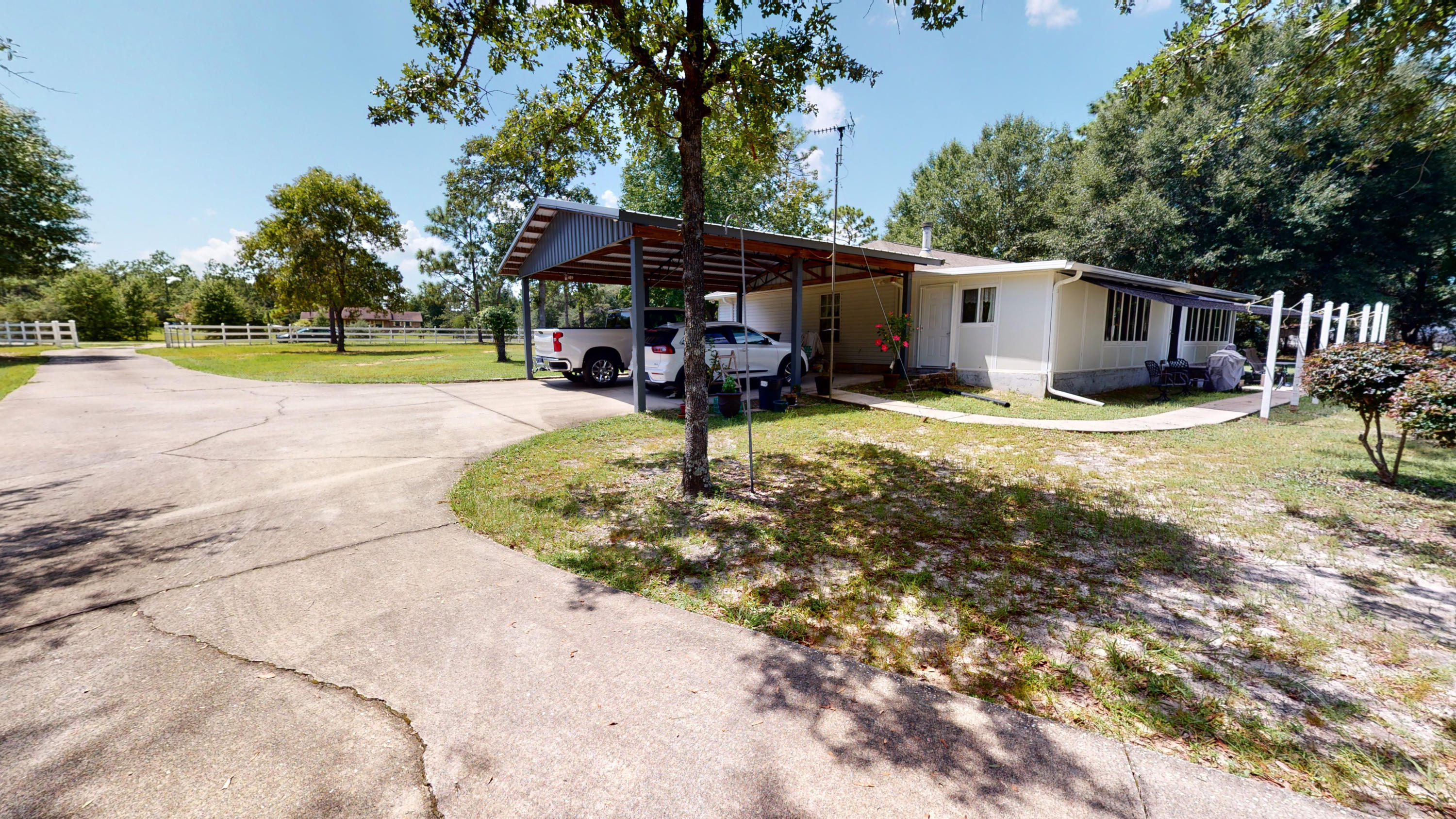 5809 Flamingo Road Crestview, FL 32539 - Photo 36 of 48 a view of a house with a yard