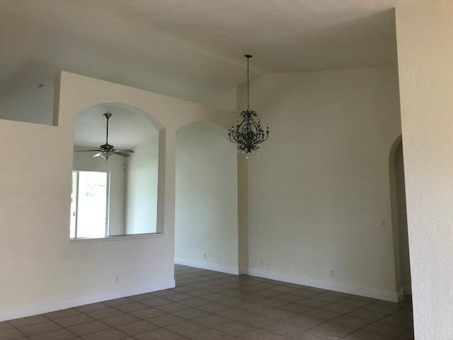 5949 Spanish River Road Fort Pierce, FL 34951 - Photo 9 of 43 a view of an empty room with a window
