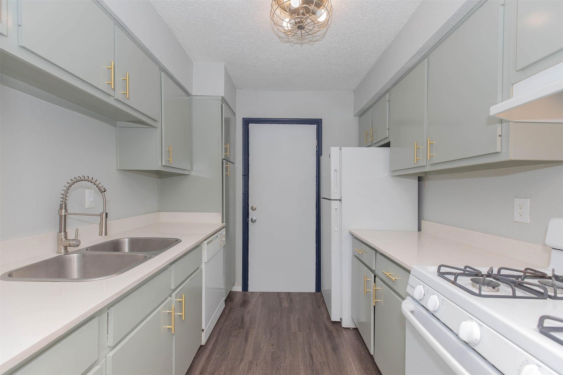 3001 Hillcroft Street, Unit G1208 Houston, TX 77057 - Photo 11 of 50 a kitchen with stainless steel appliances granite countertop a sink stove and refrigerator
