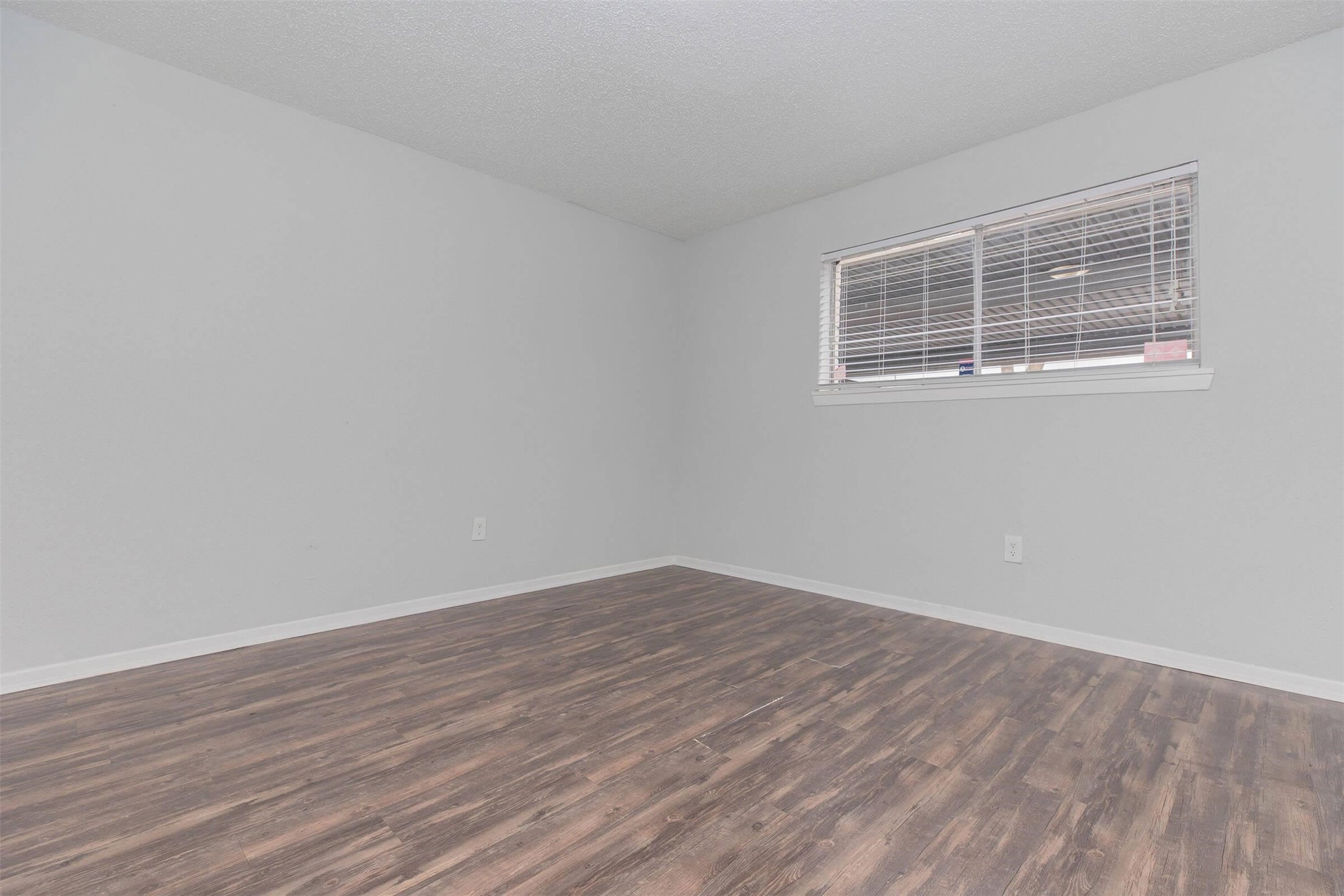 3001 Hillcroft Street, Unit G1208 Houston, TX 77057 - Photo 23 of 50 a view of empty room with wooden floor and fan
