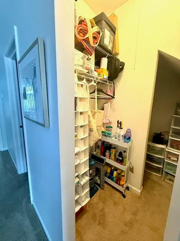 a view of living room with furniture and a fireplace