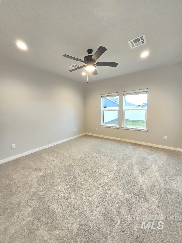 10400 Bellevue Ridge Street Nampa, ID 83687 - Photo 13 of 27 Carpeted spare room with recessed lighting and a ceiling fan