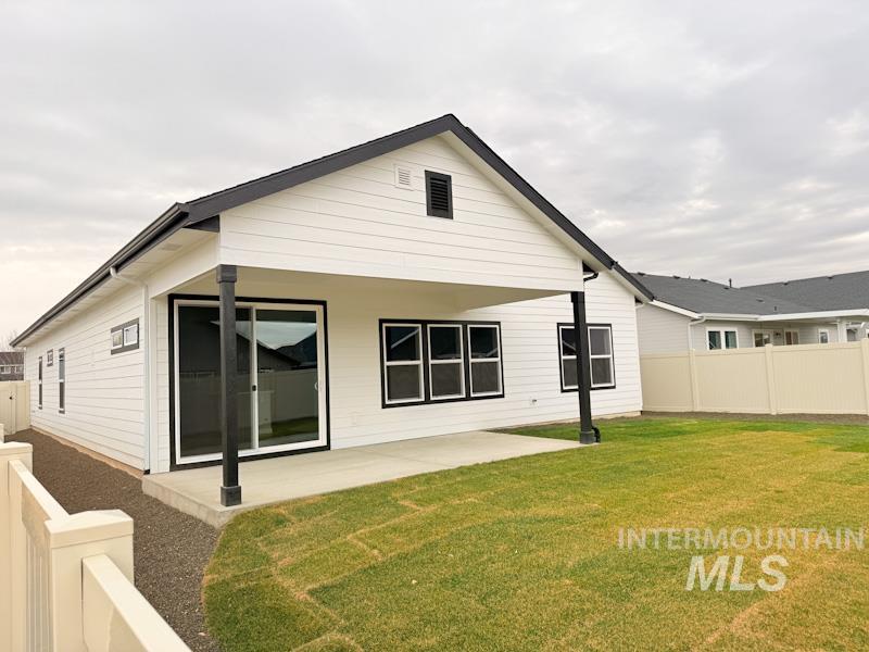 10400 Bellevue Ridge Street Nampa, ID 83687 - Photo 21 of 27 Rear view of property with a fenced backyard and a patio area
