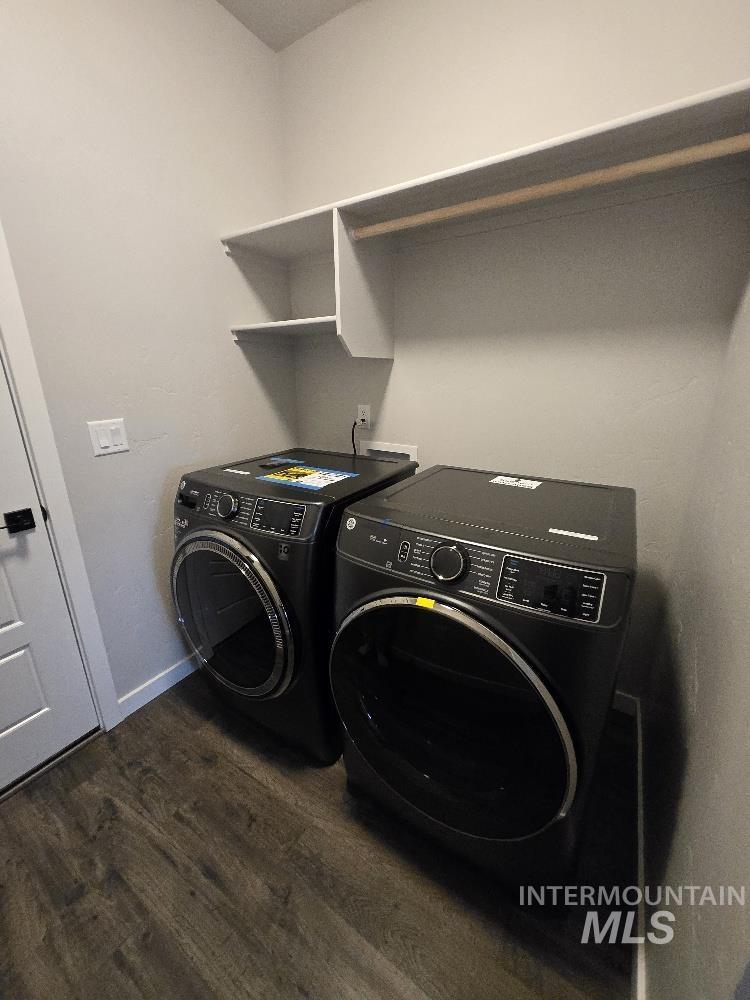 10400 Bellevue Ridge Street Nampa, ID 83687 - Photo 24 of 27 Laundry room with dark wood-style flooring and washer and dryer