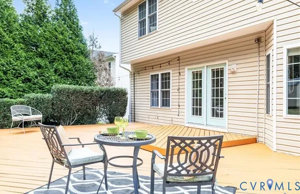 a view of a patio with table and chairs and potted plants