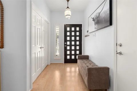 a hallway with furniture and a large window