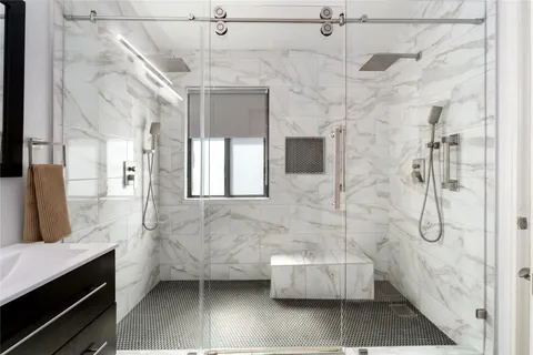 a bathroom with a sink and shower