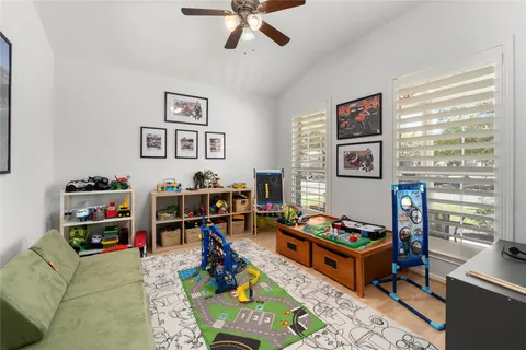 a room with furniture a rug and a window