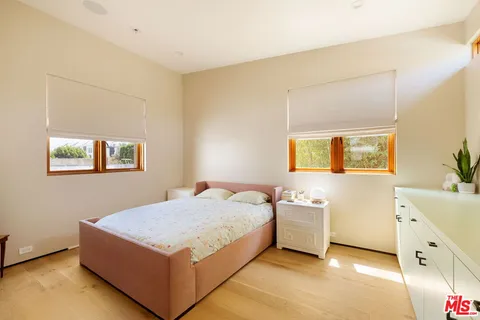 a bedroom with a bed and a table