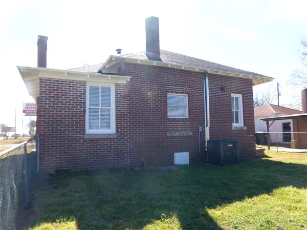 a front view of a house with a backyard