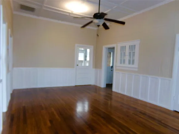 a kitchen with granite countertop white cabinets stainless steel appliances and a sink