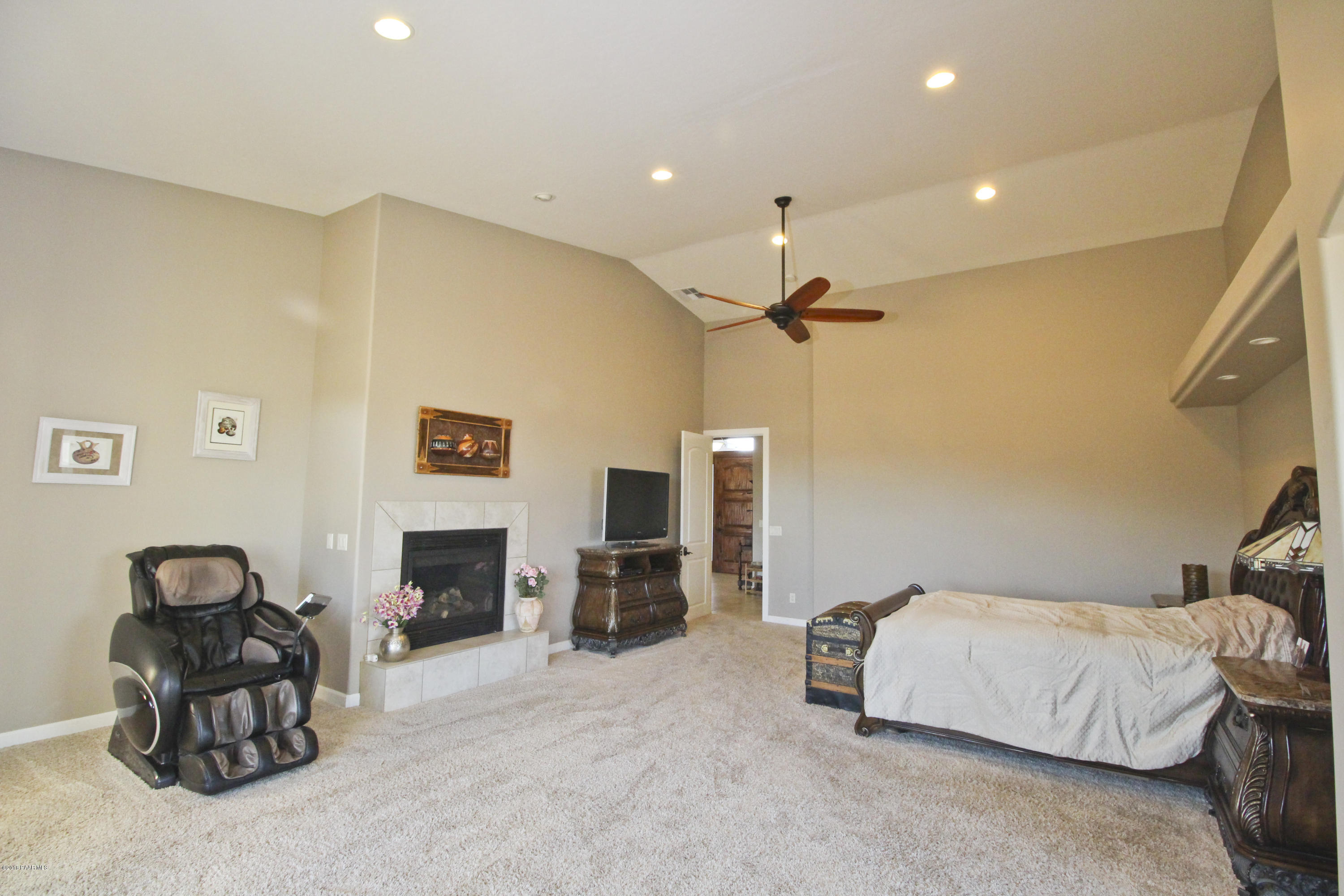4800 West Mint Creek Road Prescott, AZ 86305 - Photo 12 of 62 a spacious bedroom with a bed and furniture