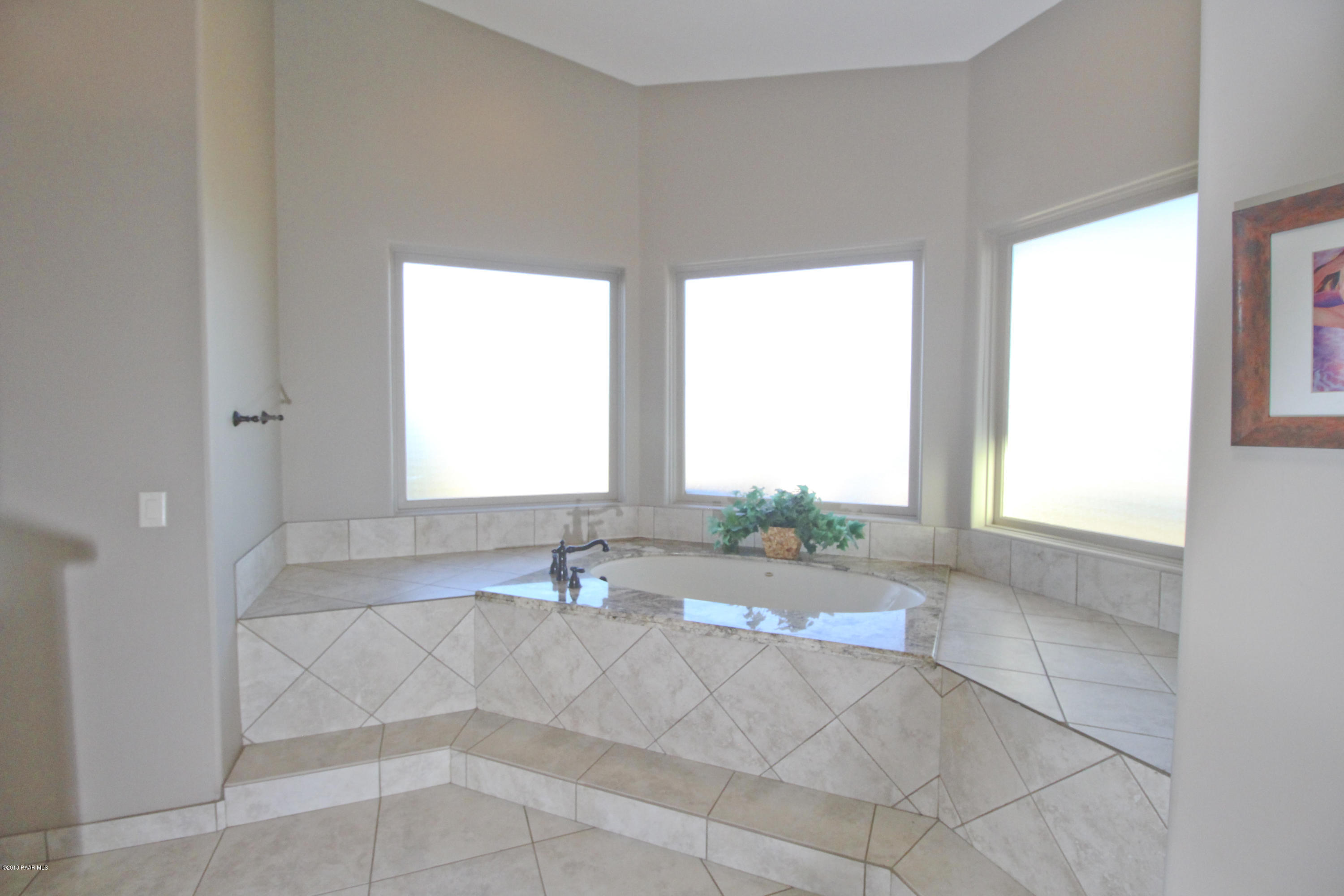 4800 West Mint Creek Road Prescott, AZ 86305 - Photo 14 of 62 a bath room with a sink and a bath tub