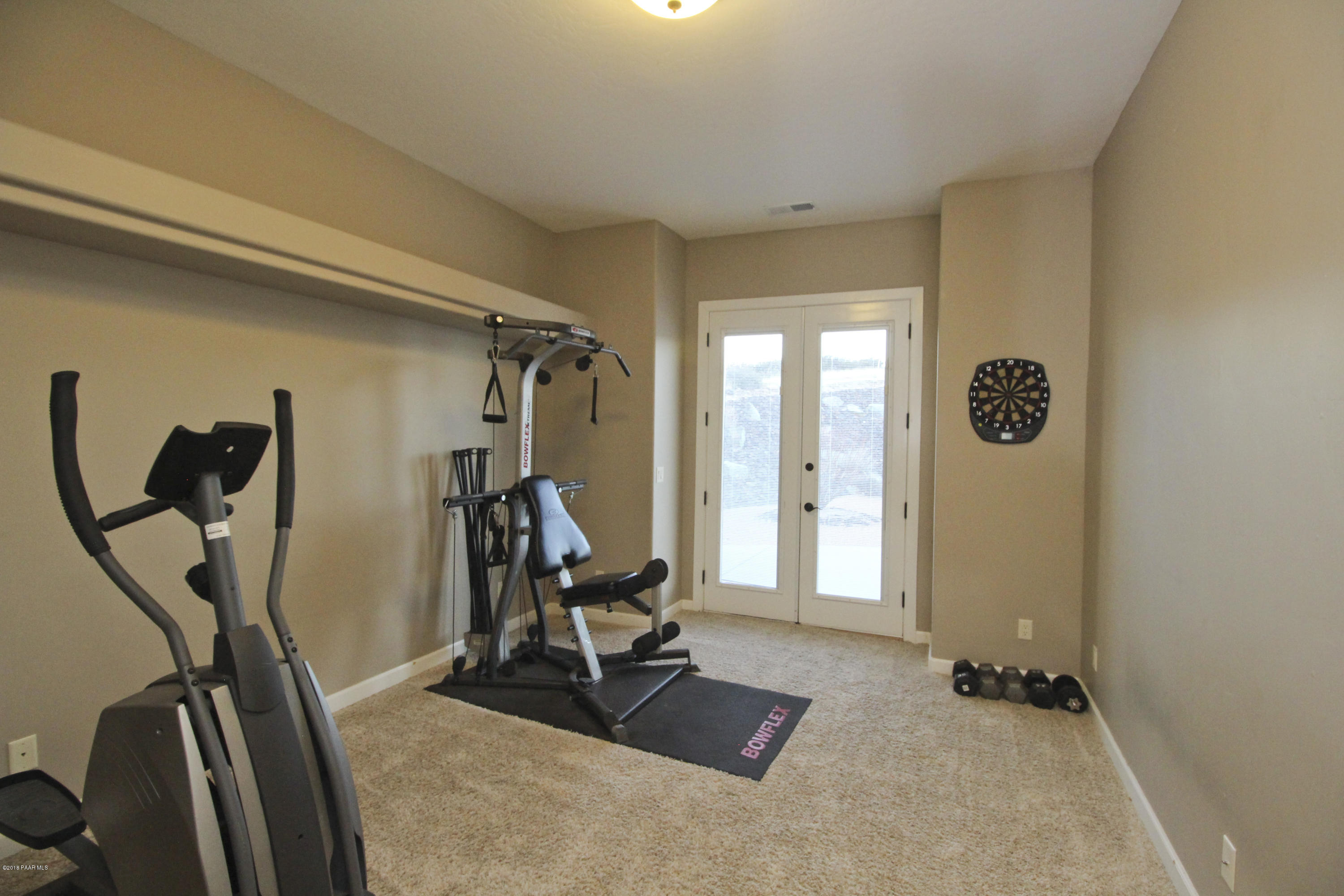 4800 West Mint Creek Road Prescott, AZ 86305 - Photo 19 of 62 a view of a room with gym equipment