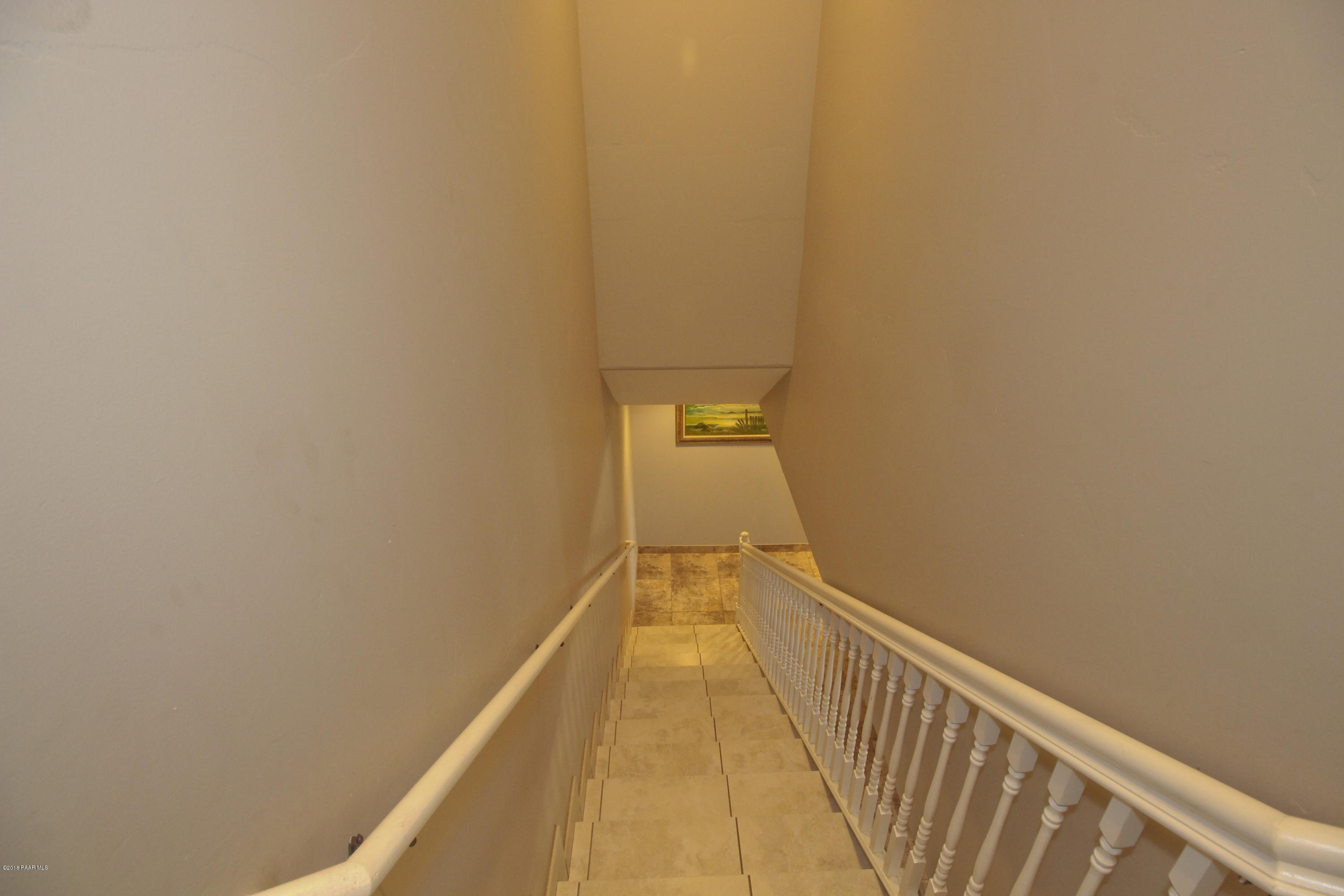 4800 West Mint Creek Road Prescott, AZ 86305 - Photo 22 of 62 a view of a hallway with wooden floor
