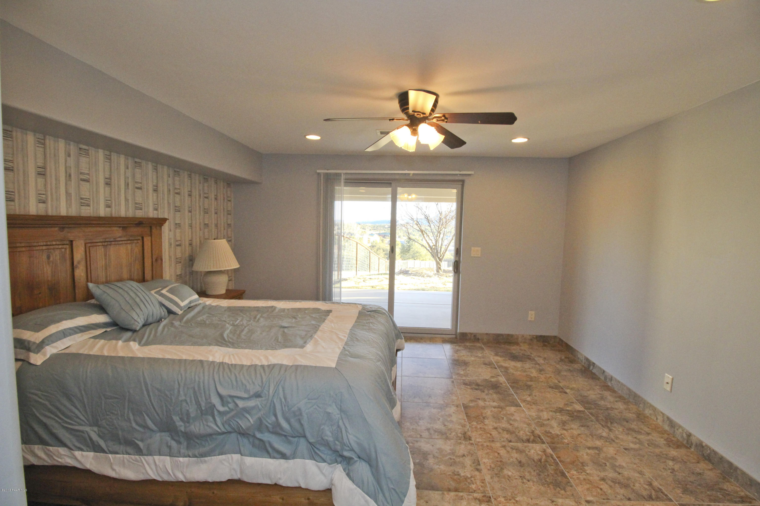 4800 West Mint Creek Road Prescott, AZ 86305 - Photo 23 of 62 a bedroom with a large bed and a window