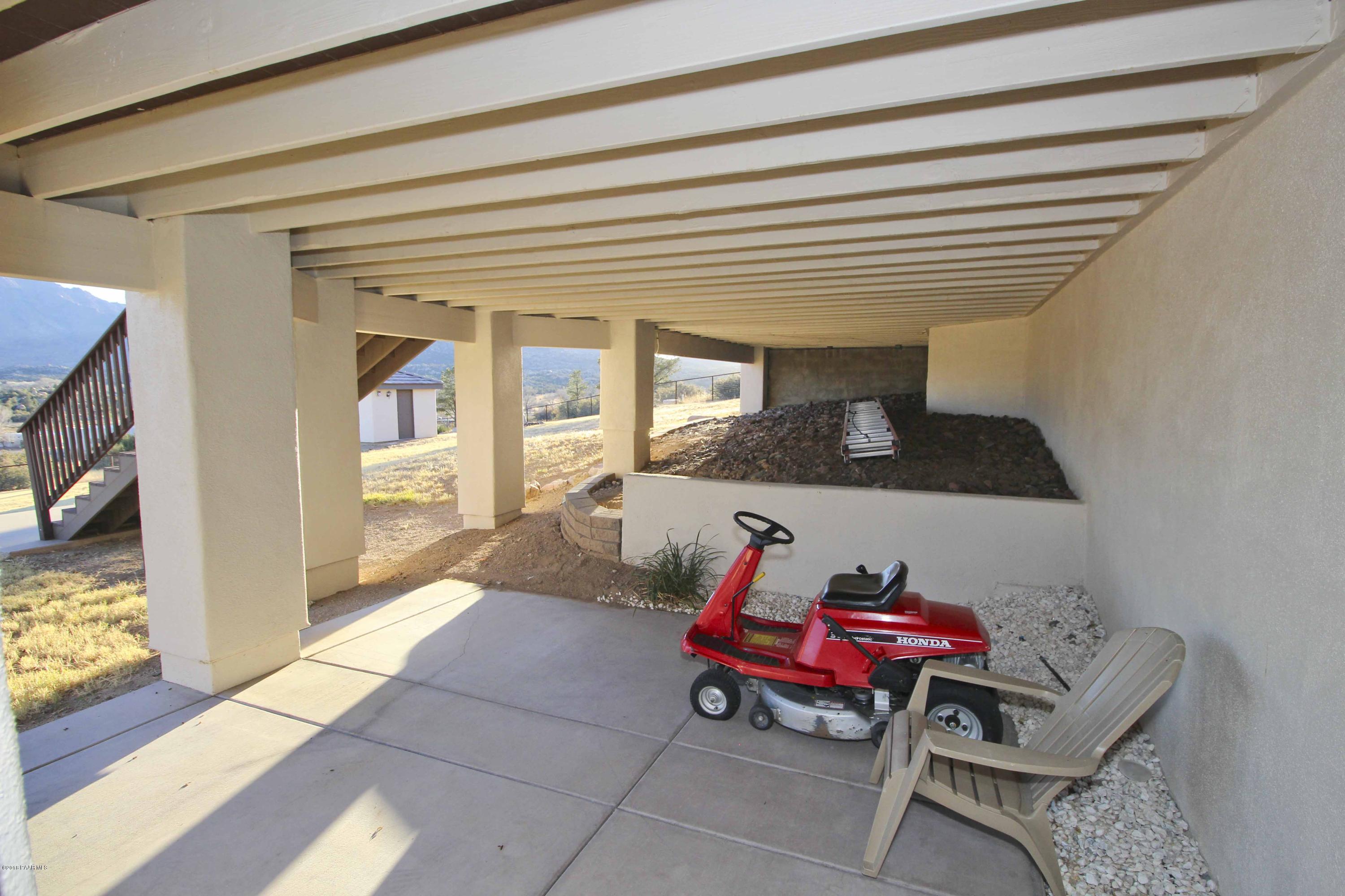 4800 West Mint Creek Road Prescott, AZ 86305 - Photo 27 of 62 a living room with furniture and a flat screen tv