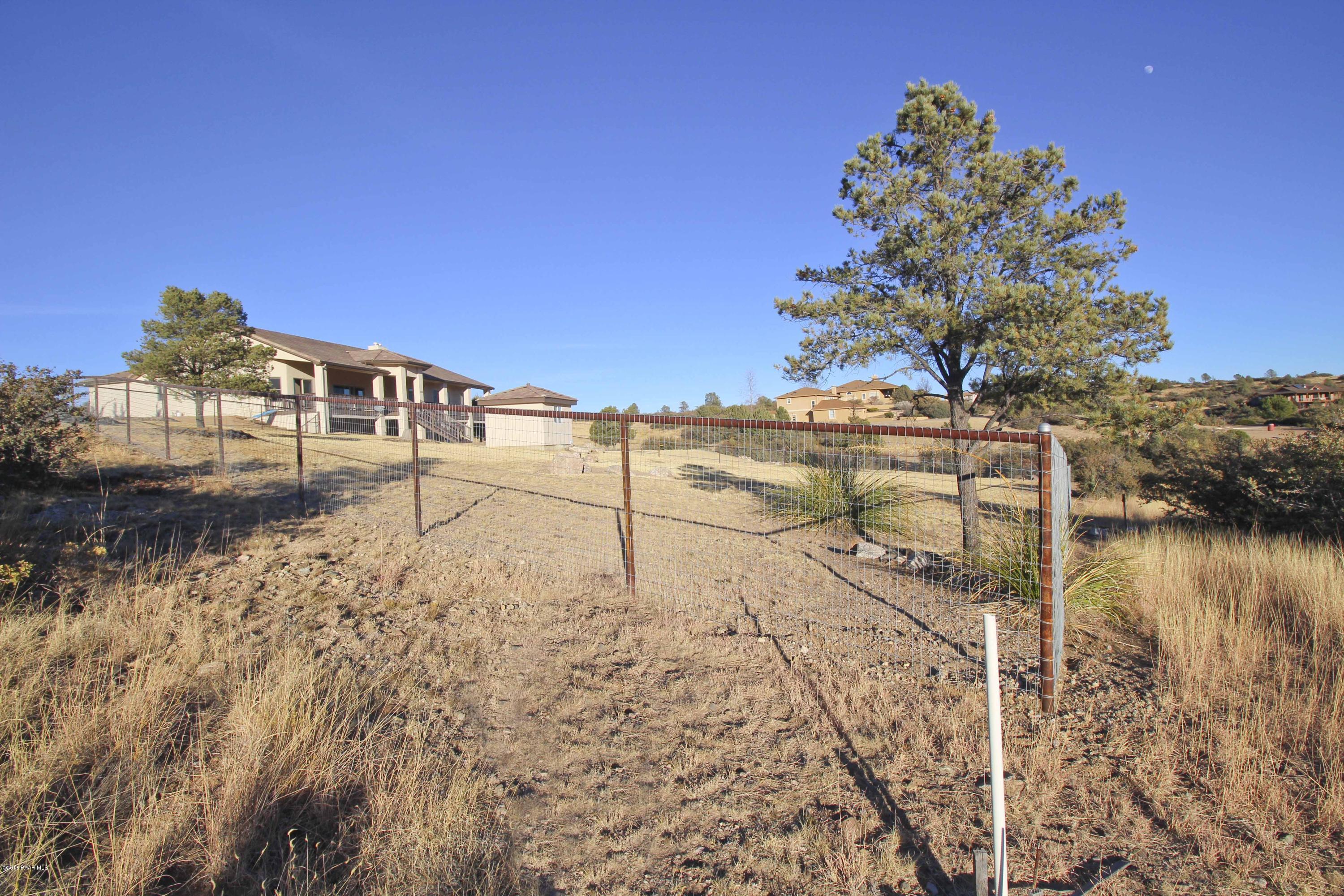 4800 West Mint Creek Road Prescott, AZ 86305 - Photo 38 of 62 a view of a lake with a yard