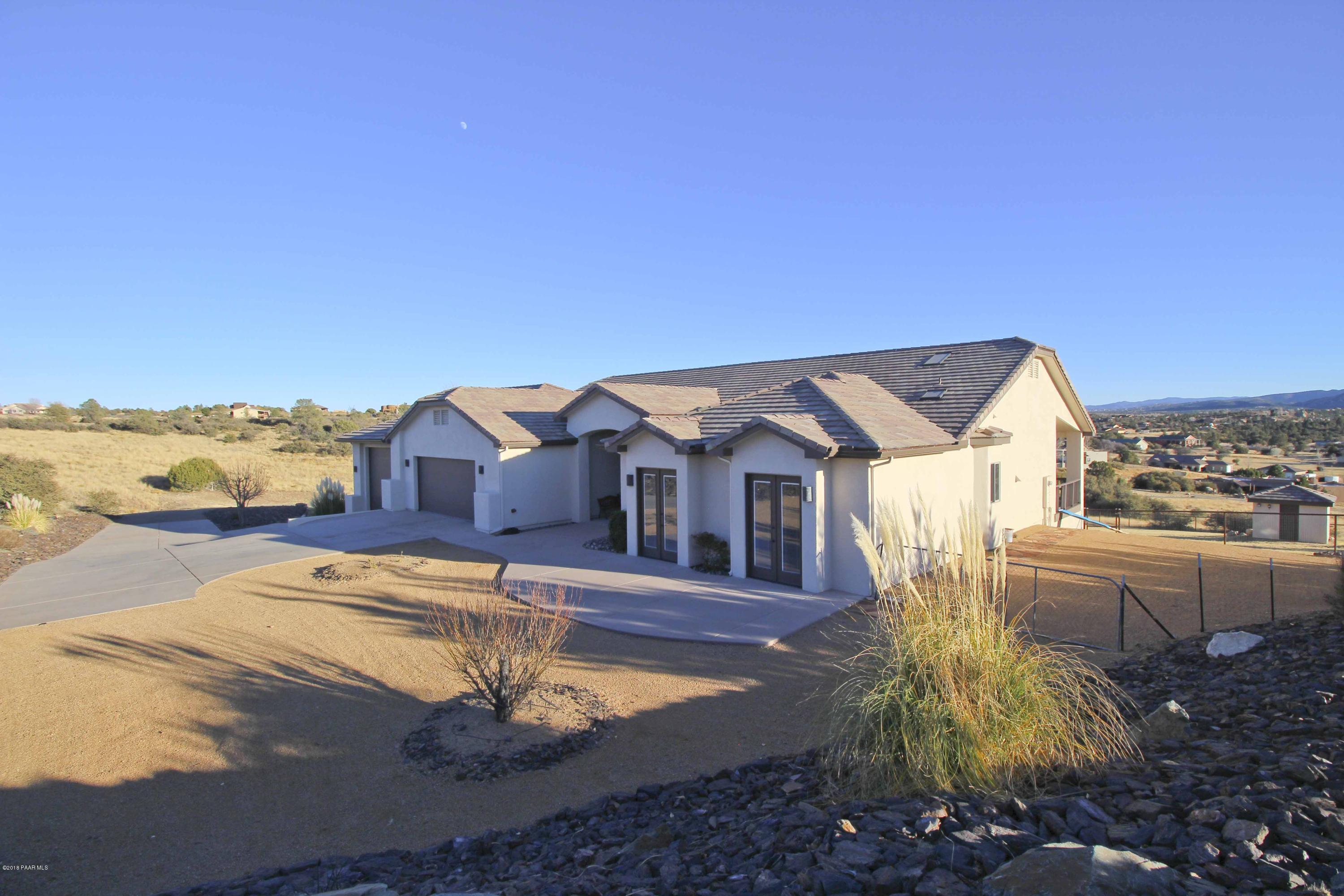 4800 West Mint Creek Road Prescott, AZ 86305 - Photo 44 of 62 a front view of a house with a yard