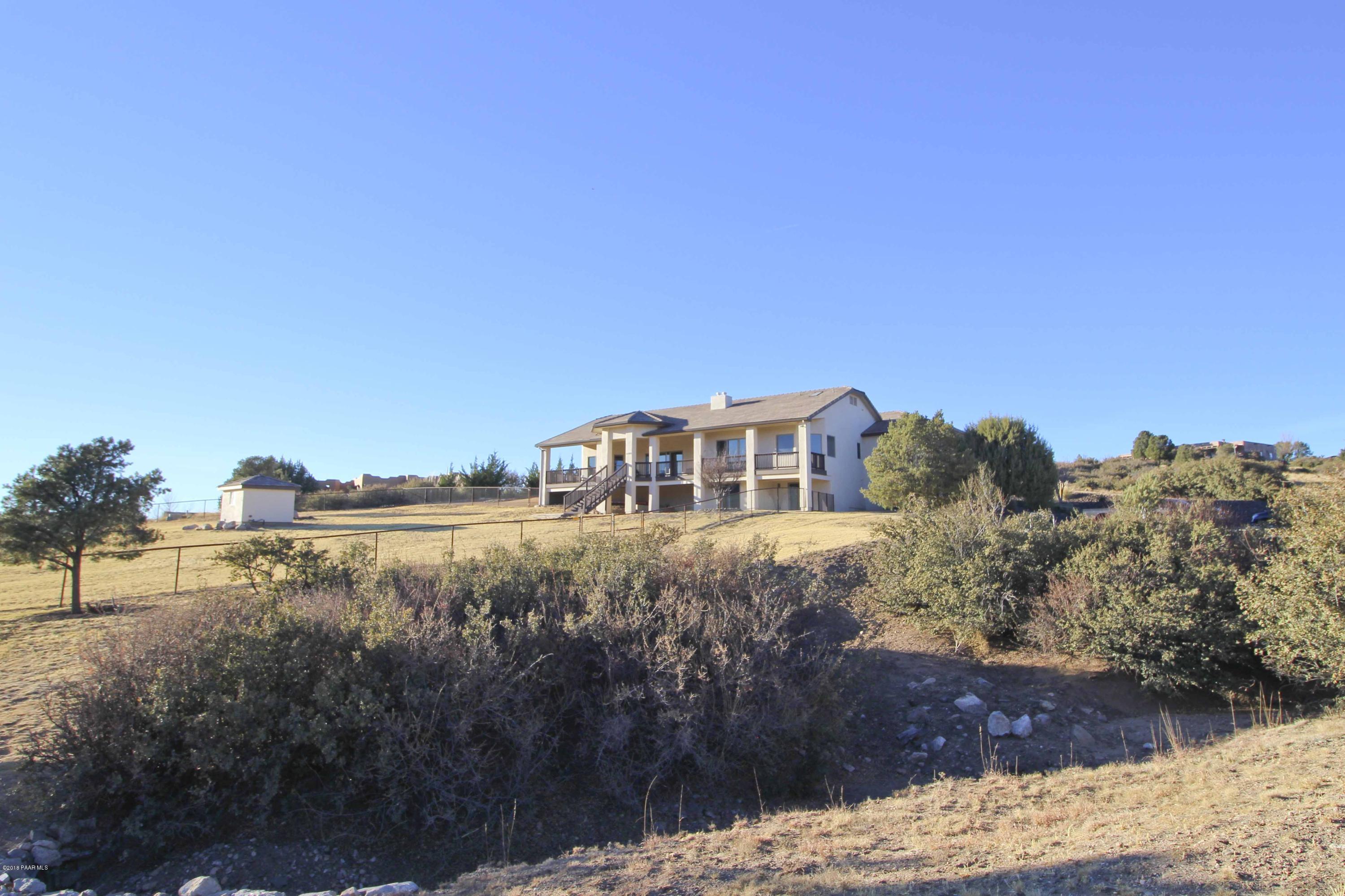 4800 West Mint Creek Road Prescott, AZ 86305 - Photo 45 of 62 a view of a house with a yard