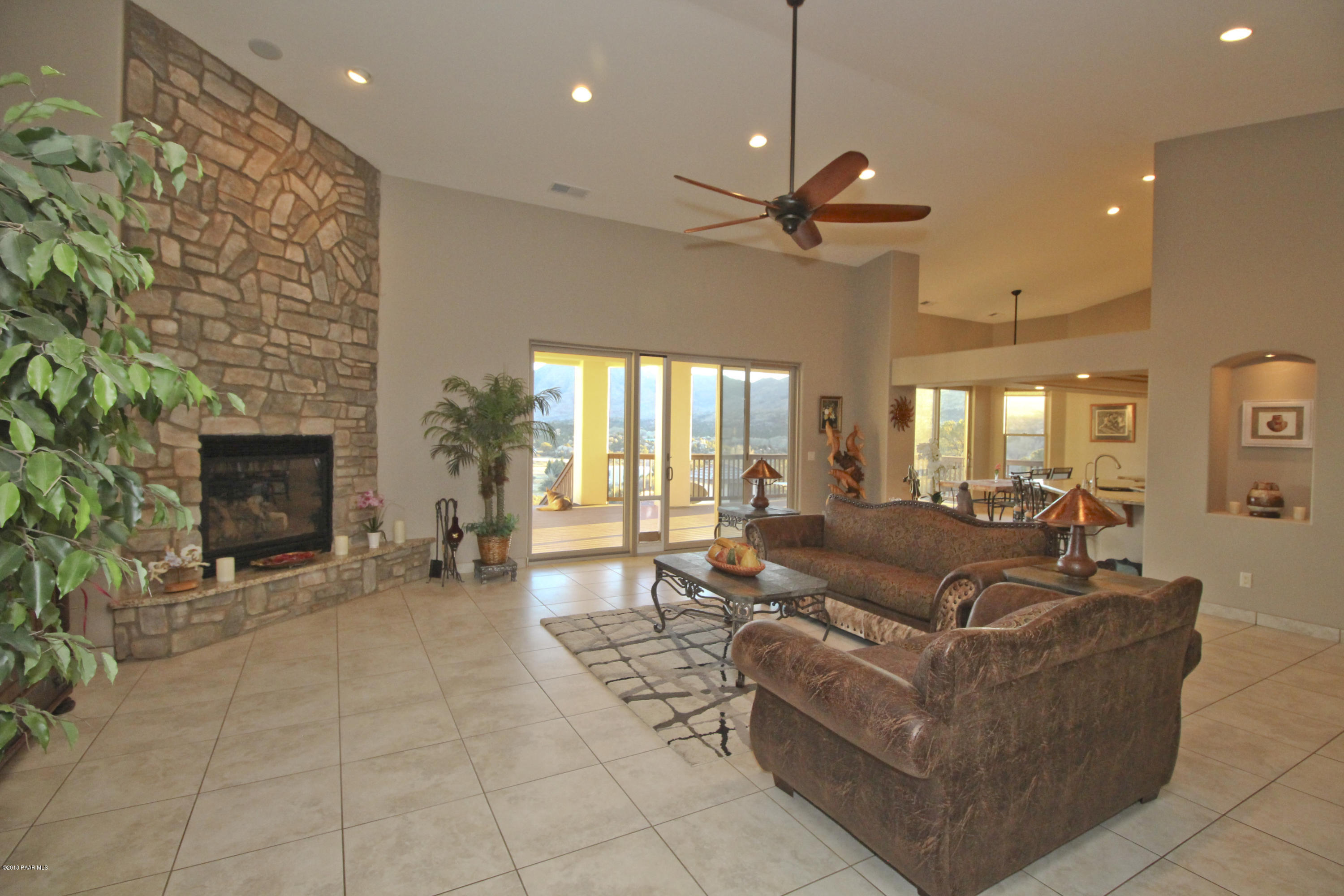 4800 West Mint Creek Road Prescott, AZ 86305 - Photo 6 of 62 a living room with furniture and a fireplace