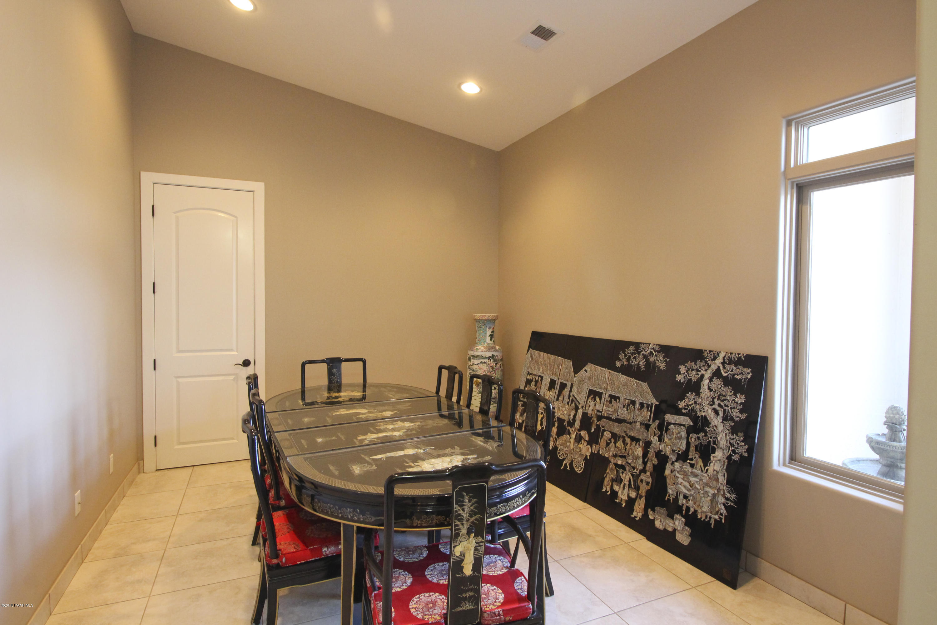 4800 West Mint Creek Road Prescott, AZ 86305 - Photo 10 of 62 a view of a dining room with furniture and wooden floor