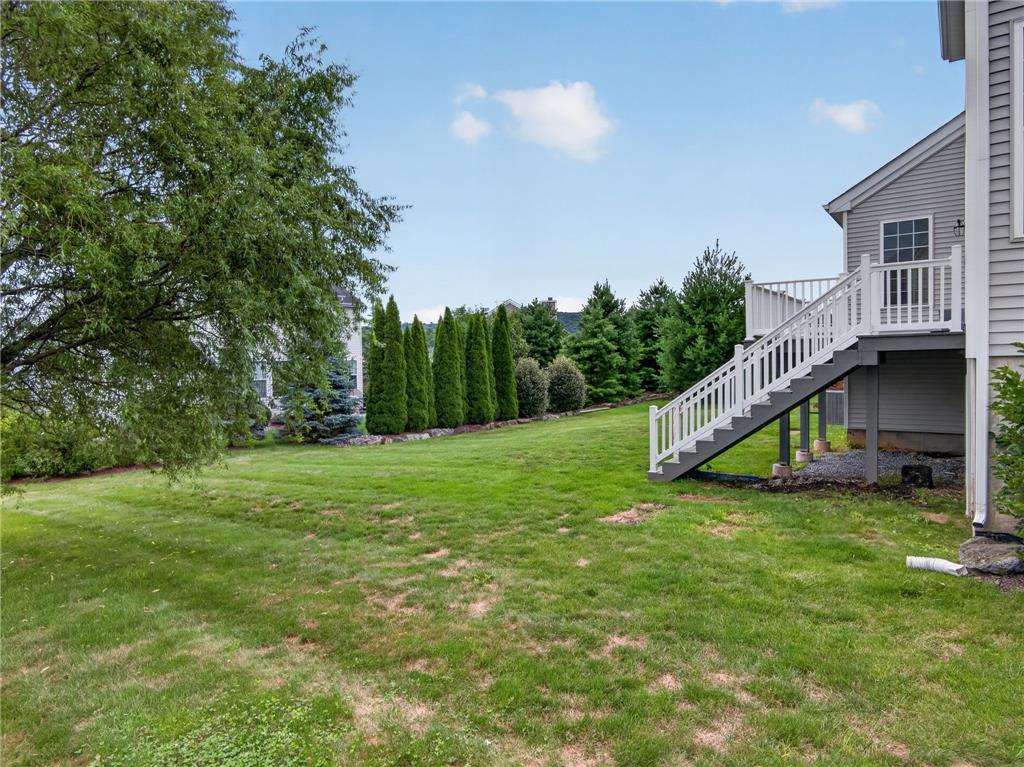 2765 Farmstead Road Easton, PA 18040 - Photo 46 of 50 A well-kept green lawn extends from the back of the house, offering ample space for outdoor enjoyment.