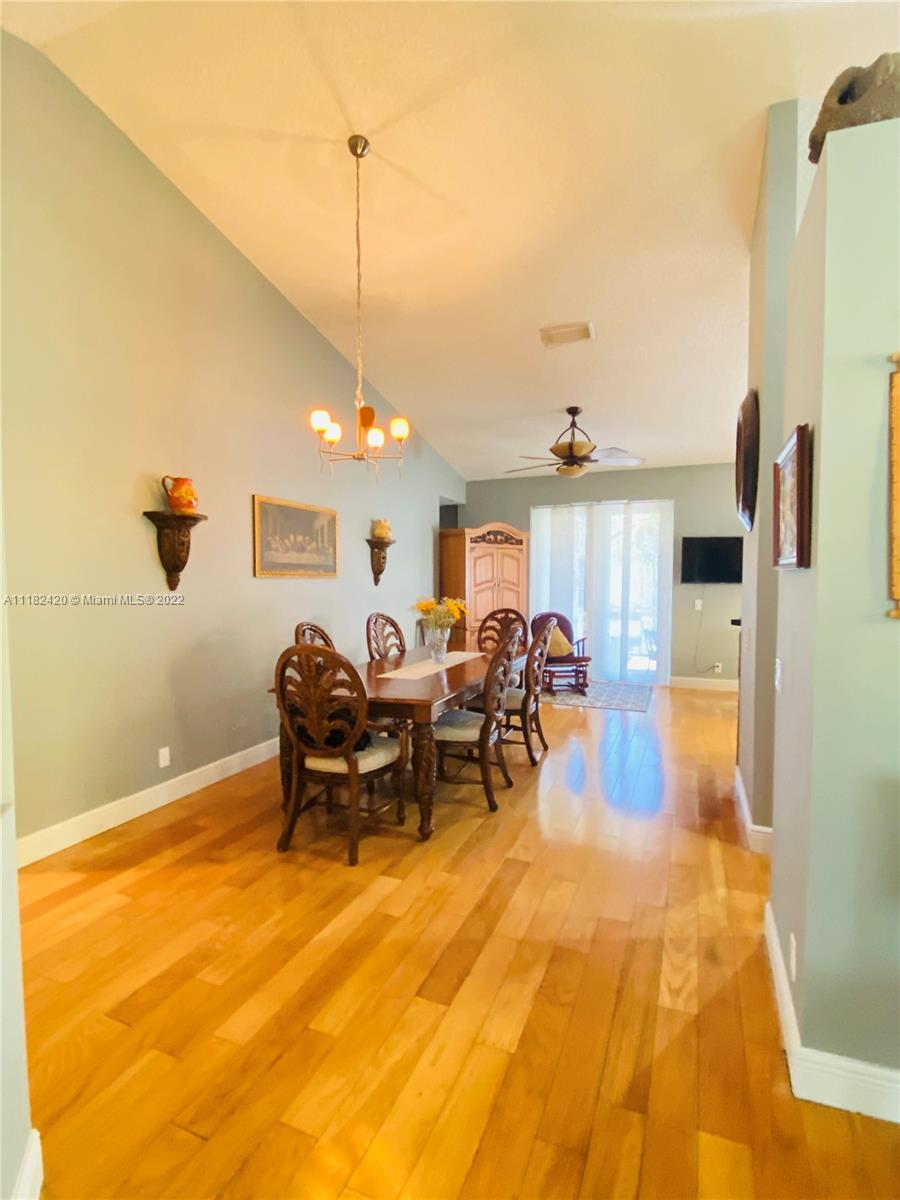 944 Falling Water Road Weston, FL 33326 - Photo 11 of 37 a very nice looking room with a large window and furniture