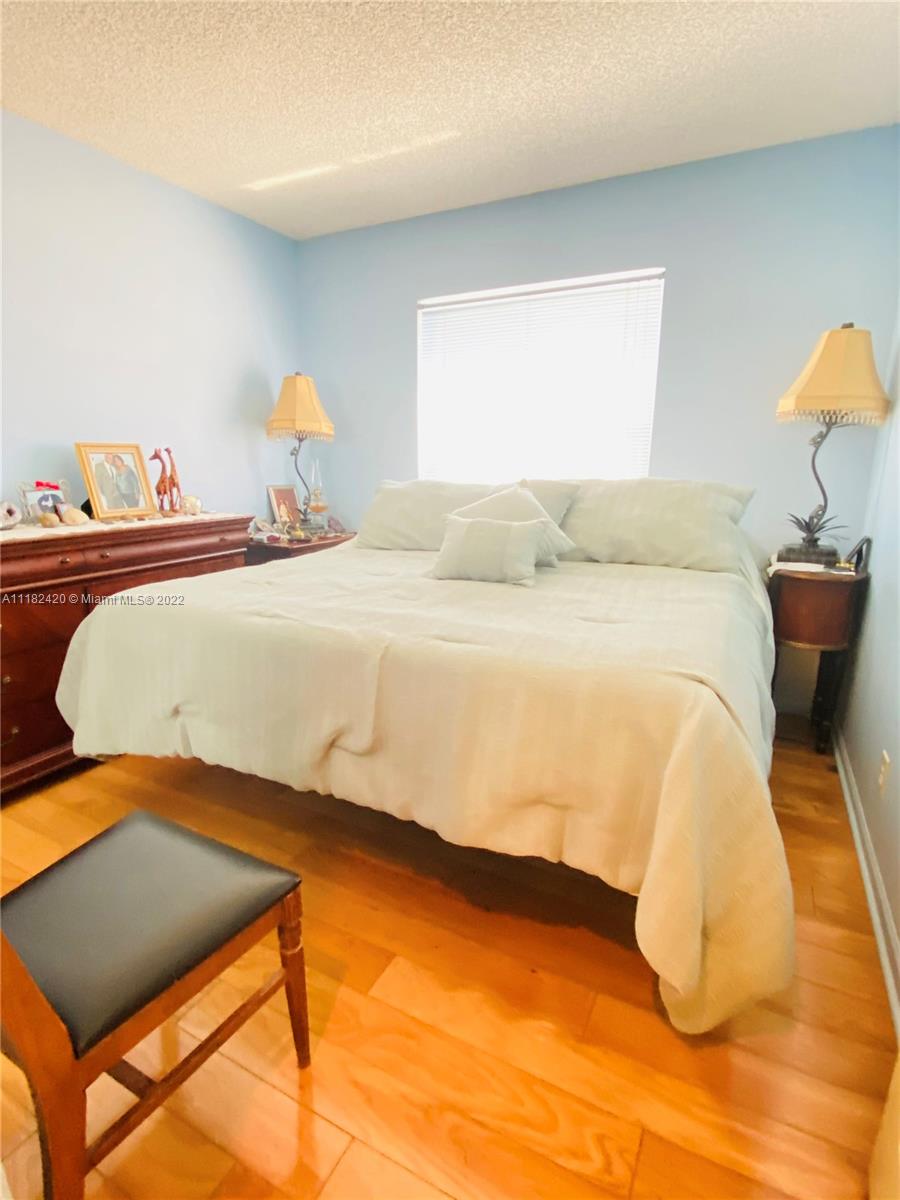 944 Falling Water Road Weston, FL 33326 - Photo 15 of 37 a bedroom with a bed and window
