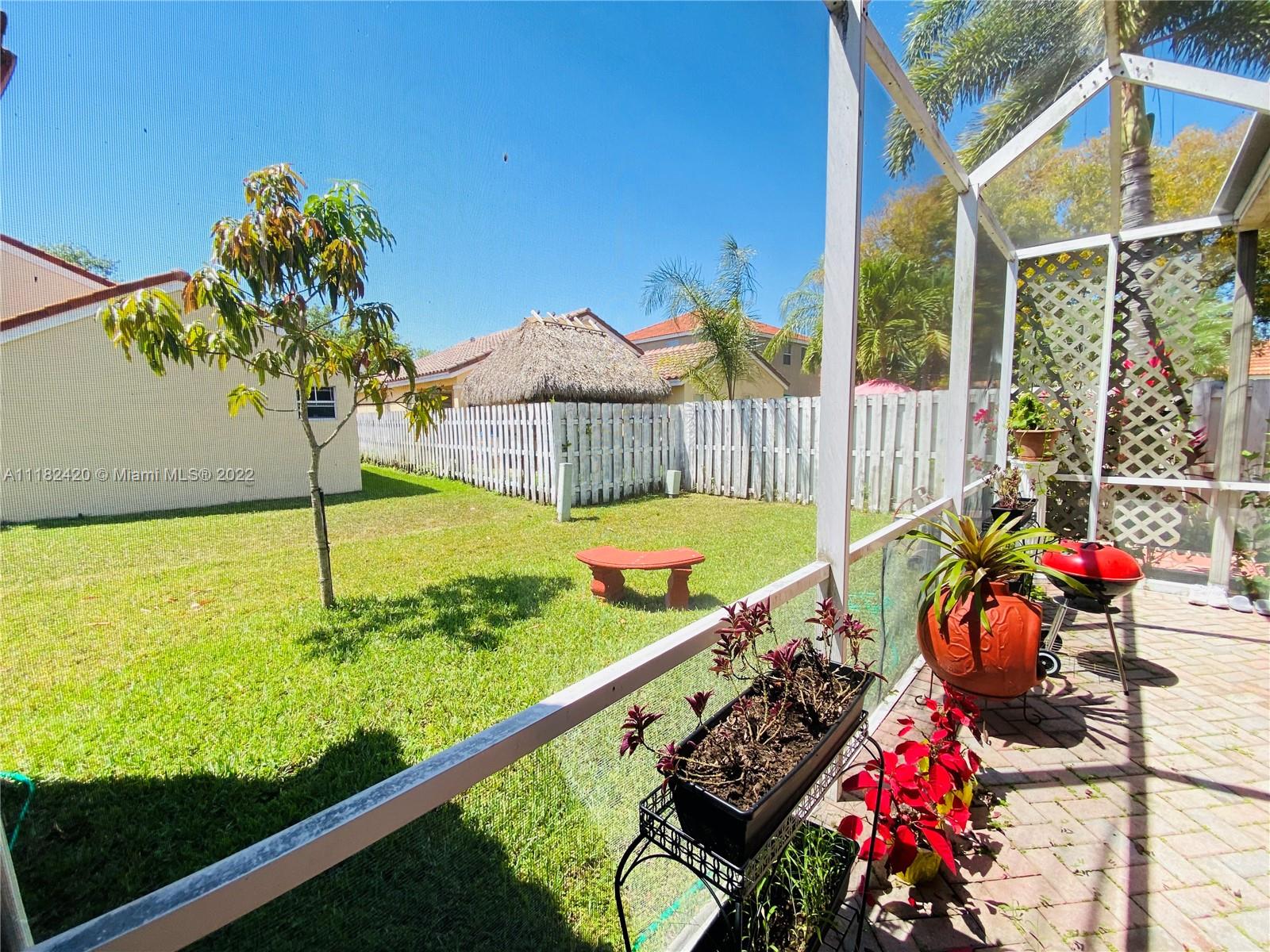 944 Falling Water Road Weston, FL 33326 - Photo 28 of 37 a view of a chairs and table in the balcony