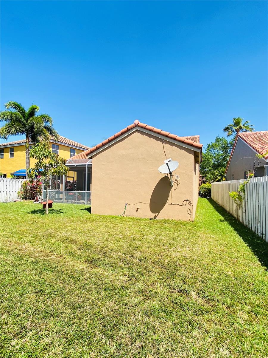 944 Falling Water Road Weston, FL 33326 - Photo 31 of 37 a house view with swimming pool in front of it