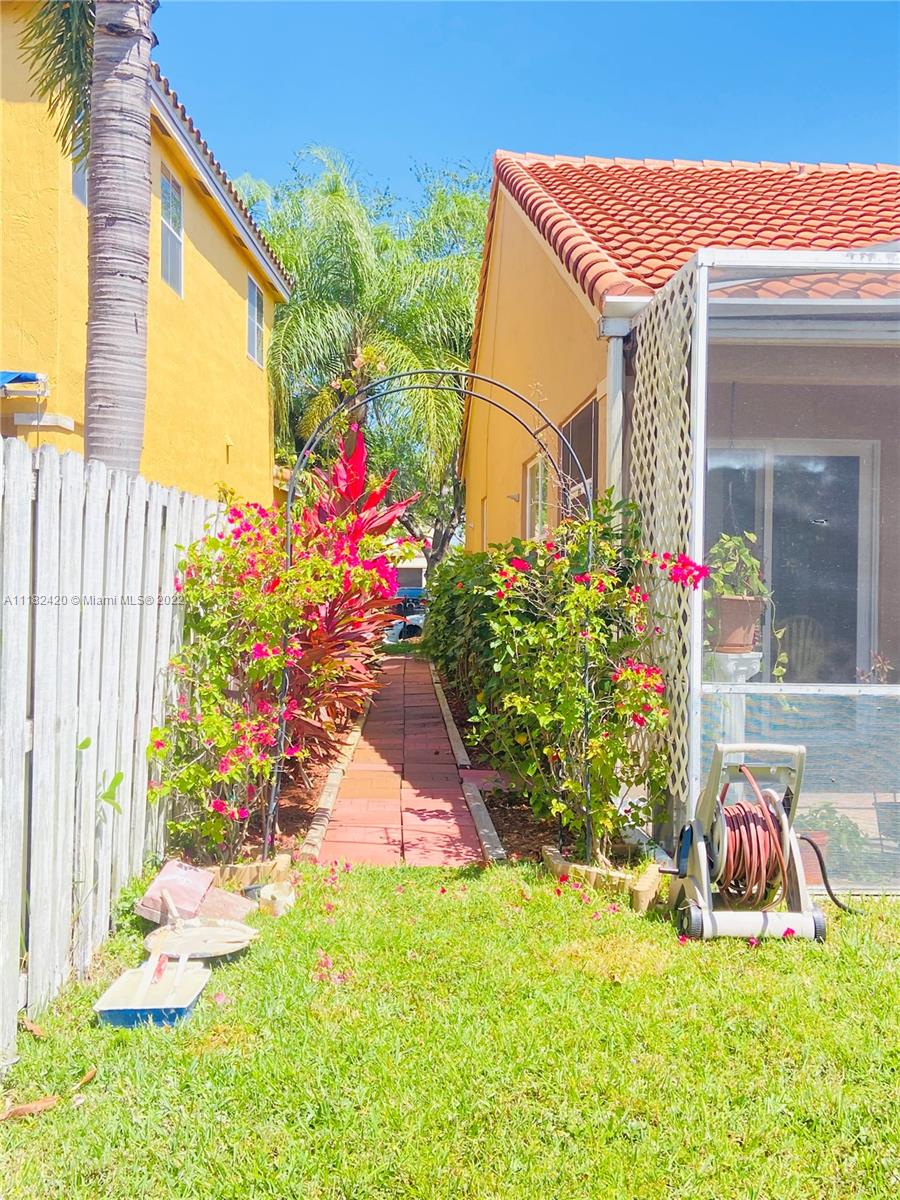 944 Falling Water Road Weston, FL 33326 - Photo 32 of 37 a front view of a house with a yard