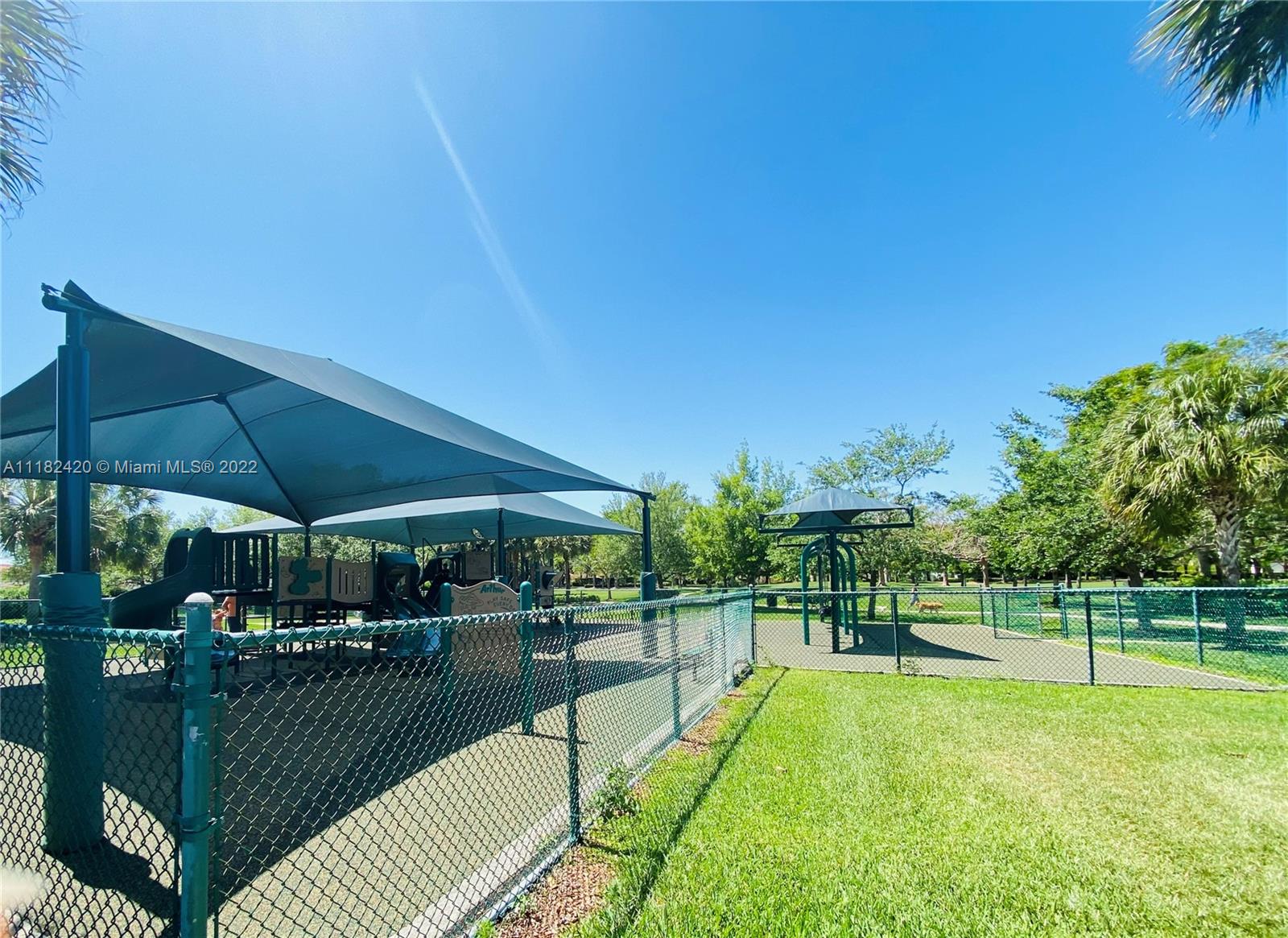 944 Falling Water Road Weston, FL 33326 - Photo 34 of 37 a view of a swimming pool and sitting area