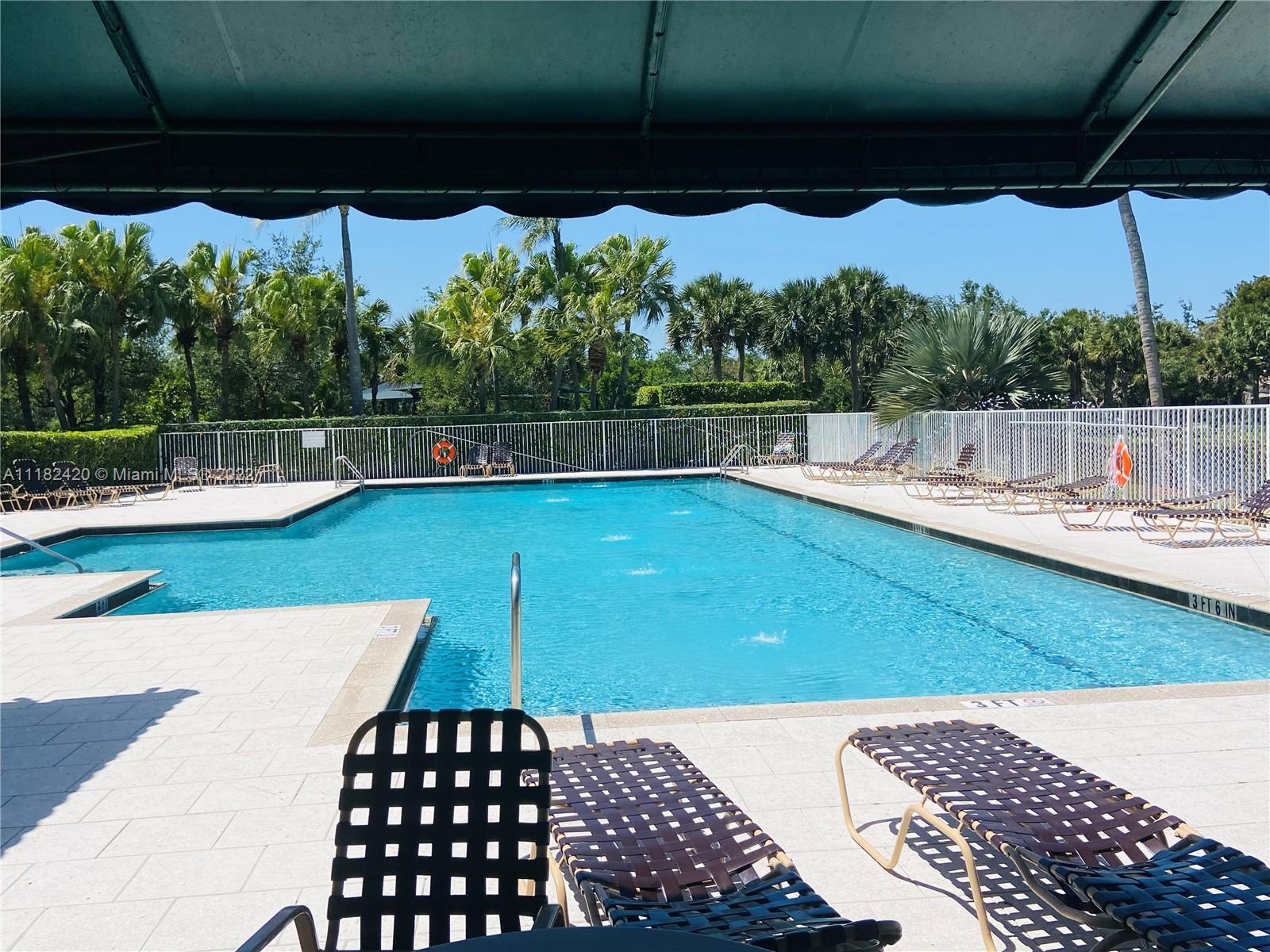 944 Falling Water Road Weston, FL 33326 - Photo 35 of 37 a view of a swimming pool with a patio