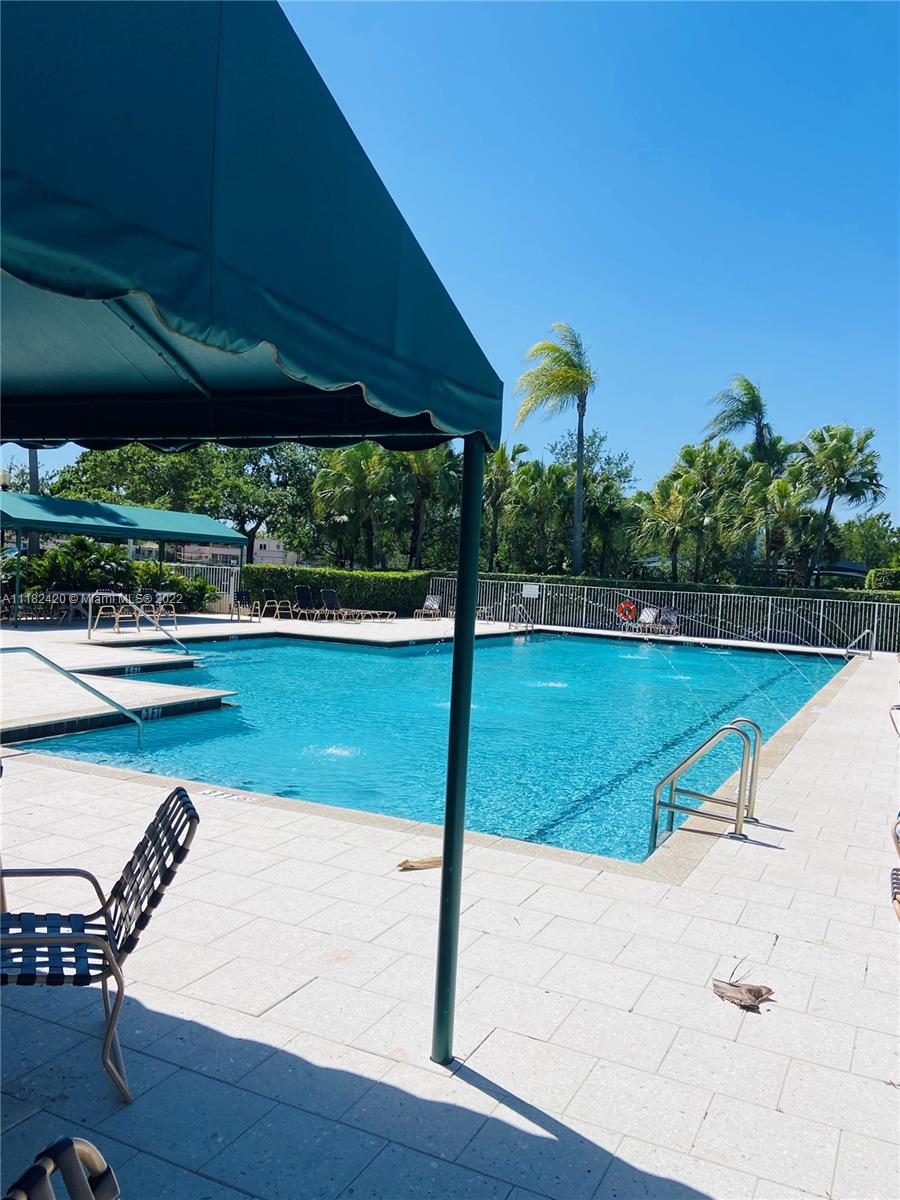 944 Falling Water Road Weston, FL 33326 - Photo 36 of 37 a view of a swimming pool with a patio