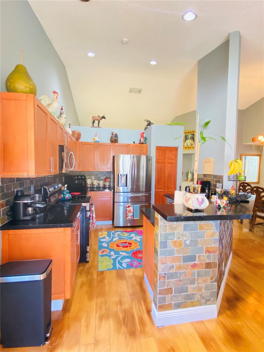 944 Falling Water Road Weston, FL 33326 - Photo 7 of 37 a view of a living room and kitchen