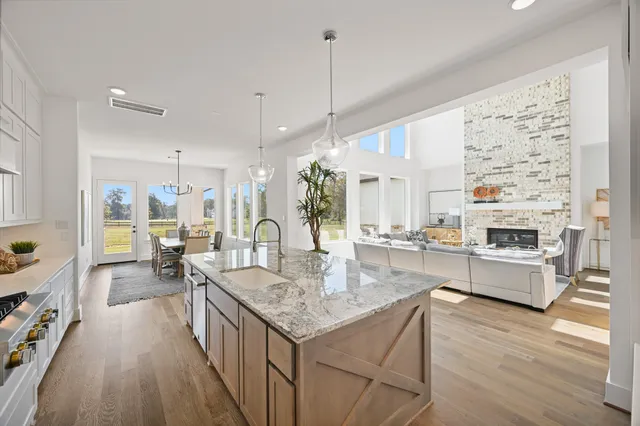a spacious bathroom with a tub and large windows