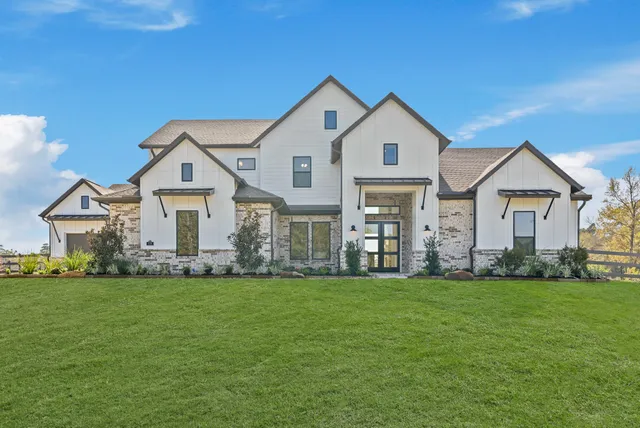 a large kitchen with lots of counter space dining table and stainless steel appliances