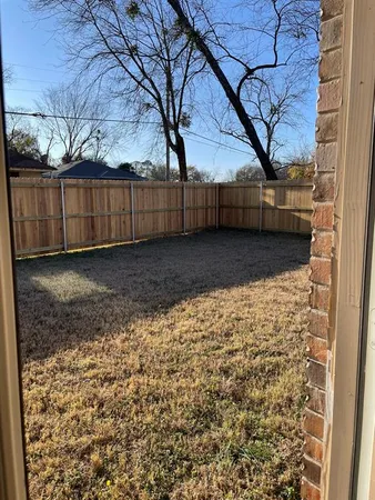 a view of a backyard of the house