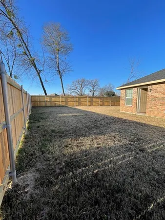 a view of a backyard of the house